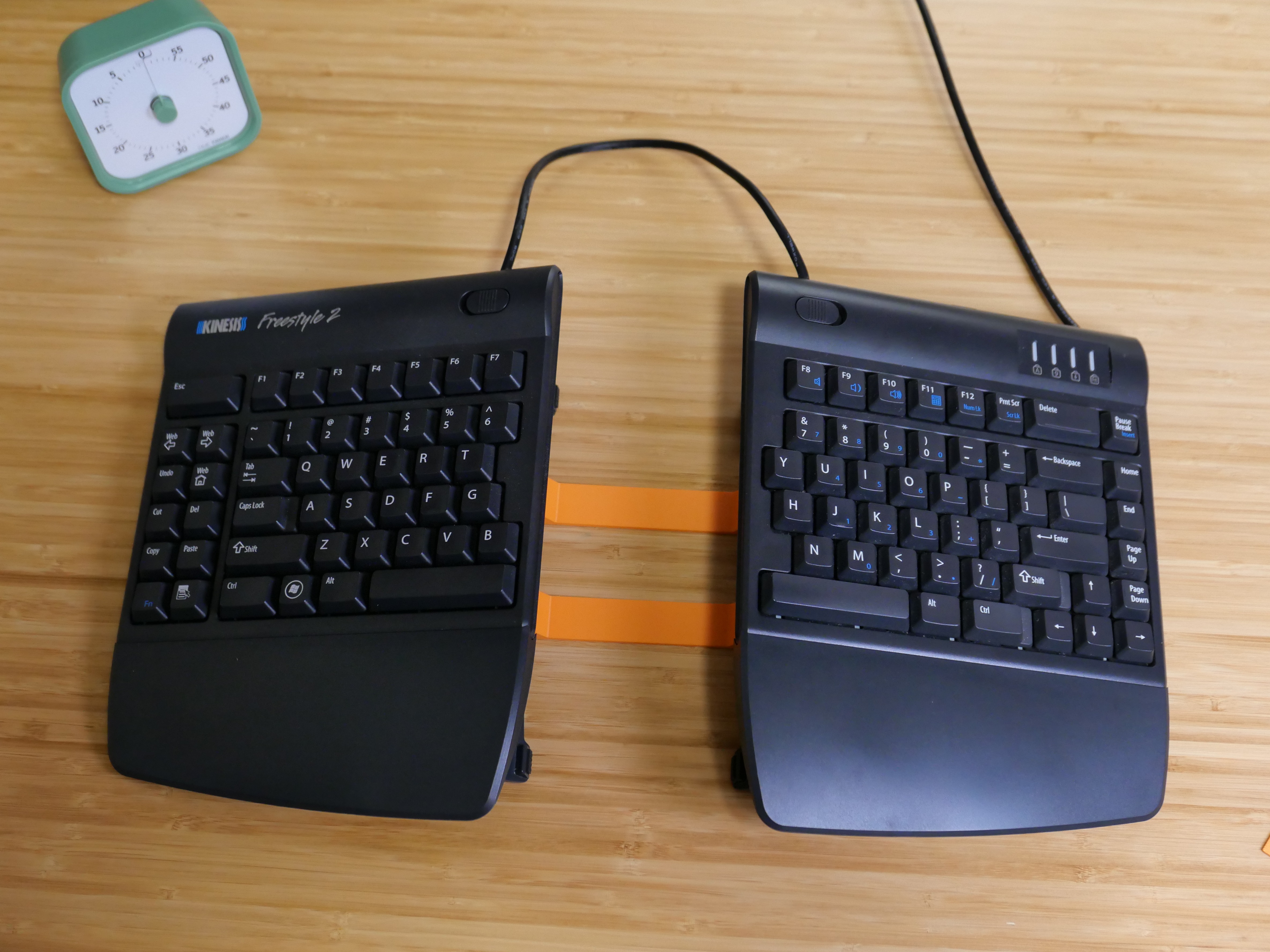 Photo showing "leashed" split keyboard after installing the new brackets